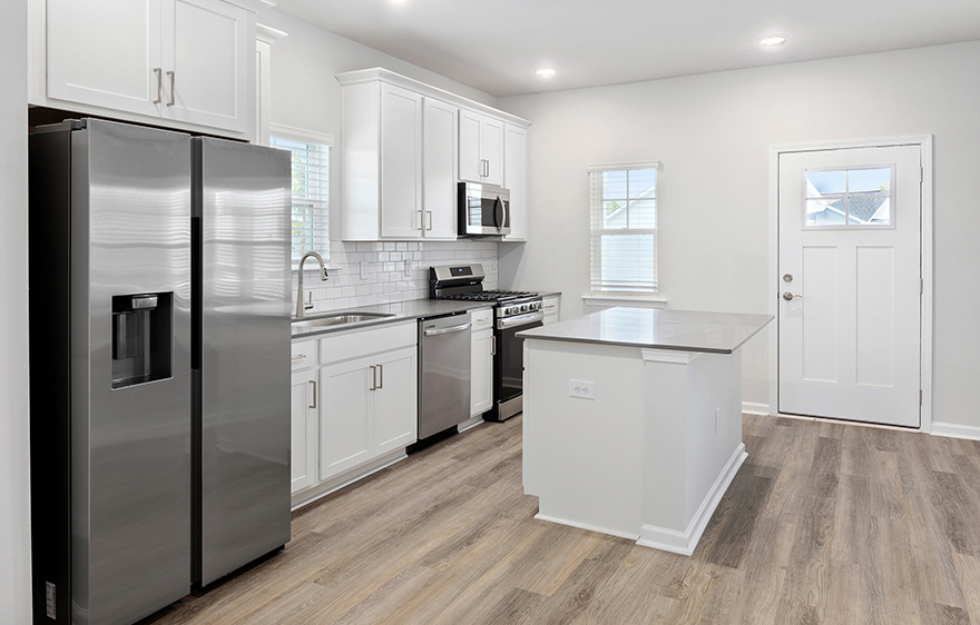 Apartment kitchen featuring stainless steel appliances